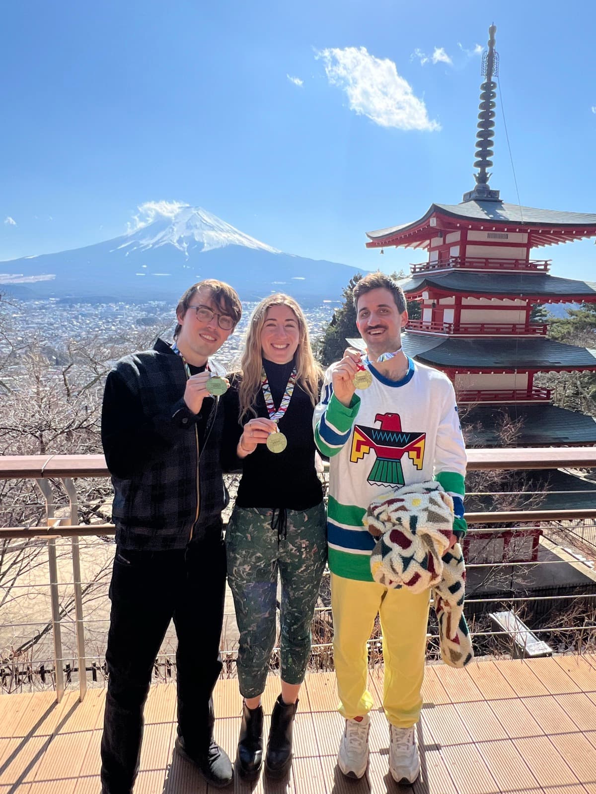 Marathon medals with Mt. Fuji and a pagoda in the background